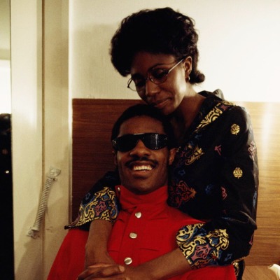 Stevie Wonder's first wife, Syreeta Wright hugging him